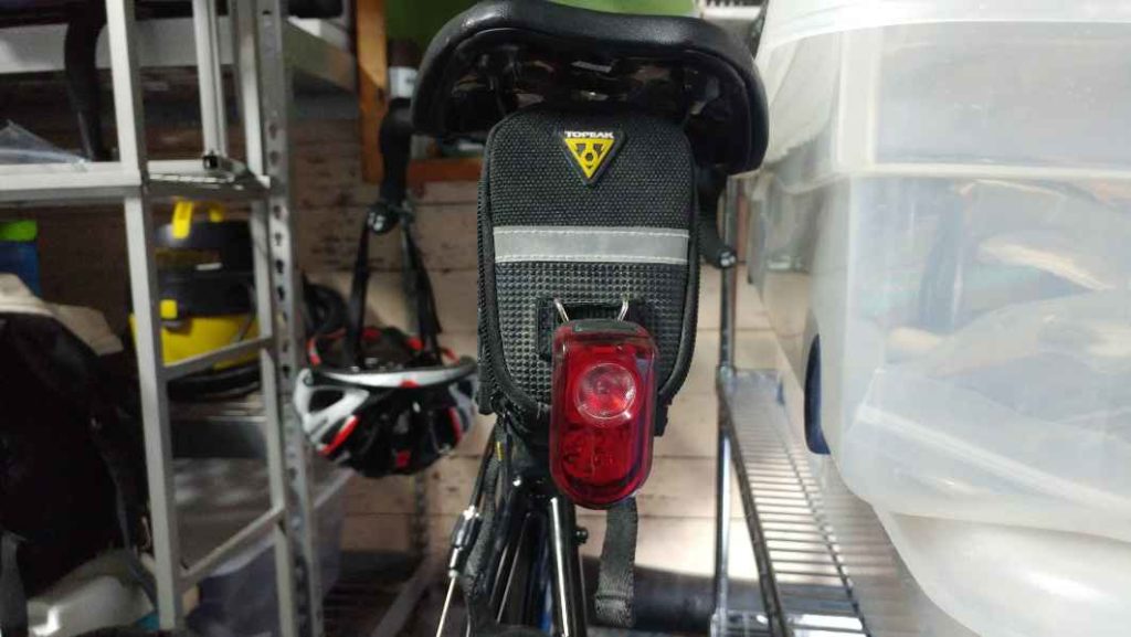 back of bike with saddle bag and rear light
