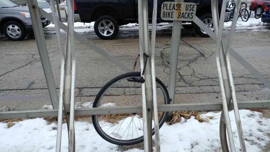 one tire locked to rack bike is gone