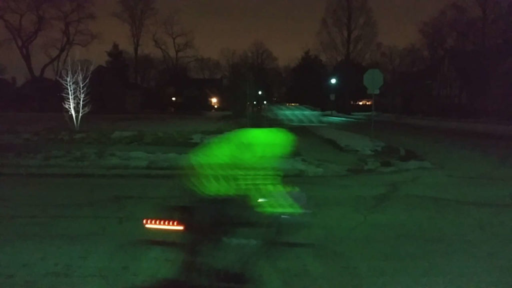 blurry rider at night close